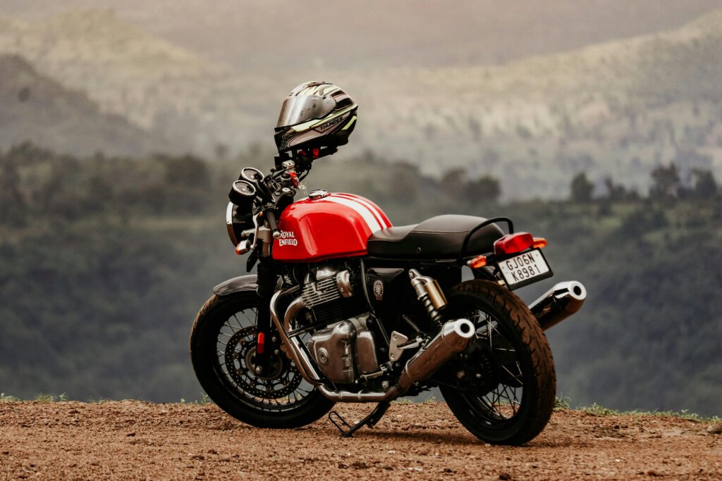 Royal Enfield motorcycle parked outdoors, showcasing a scenic backdrop in India.